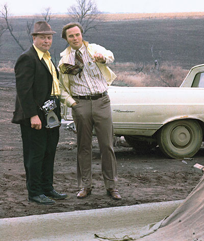 Harold and Gary Godbersen discuss a paving project in November 1974