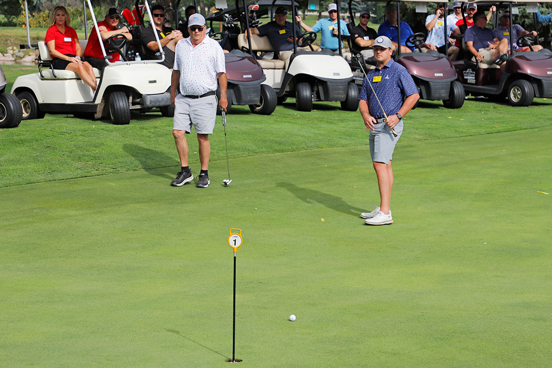 Landon Ezell, Weaver-Bailey Contracting, (right), with his putting partner, Dave Clark, Wicks Construction, came in second place in the Putting Tournament Championship.