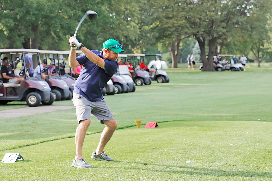 Jeremy Bahe, Croell, Inc., tees off in the Contractors' Shoot-Out. His team finished in third place.