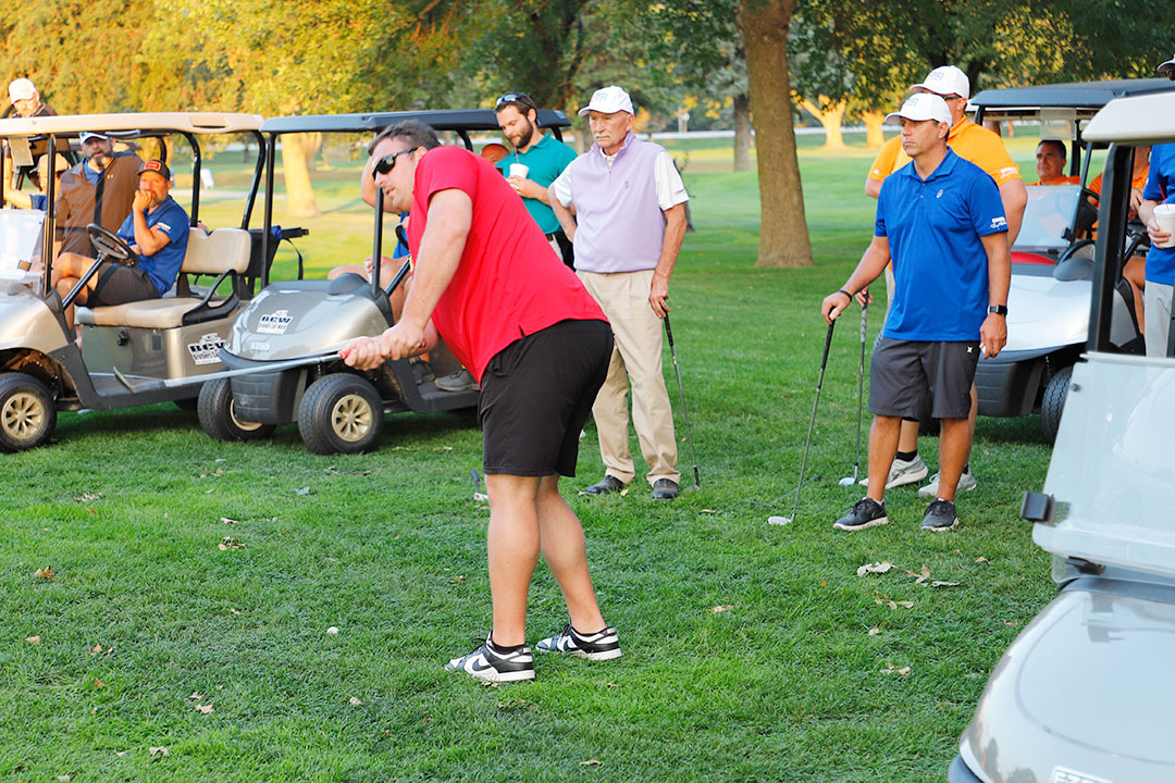 Mike Milenkovich, Kiewit Corporation, chips onto green #5 in the "Grand" Champion Shoot-Out. He was on the championship team from the Holstein course.