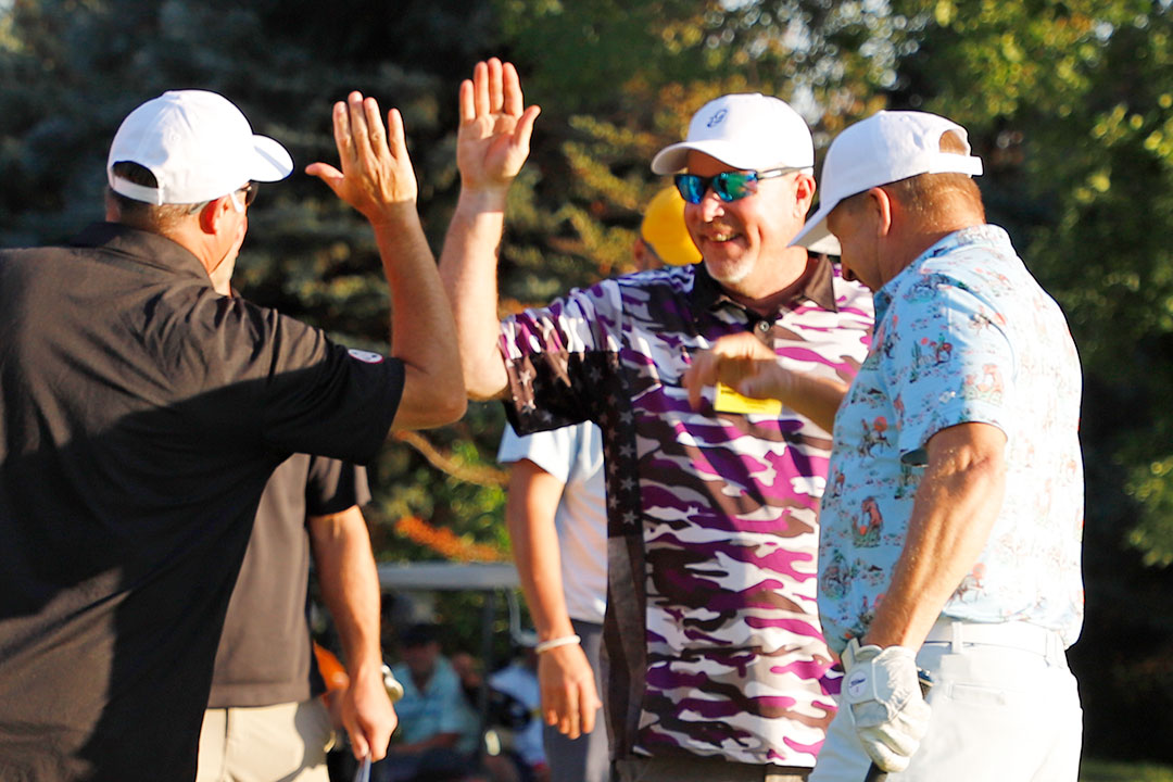 Mark Weaver of Weaver Bailey Contractors, Inc. (center), was a two-time winner at Invitational #42. He was on the Scramble Tournament championship team for Mapleton, and also on the winning team in the Contractors' Shoot-Out.