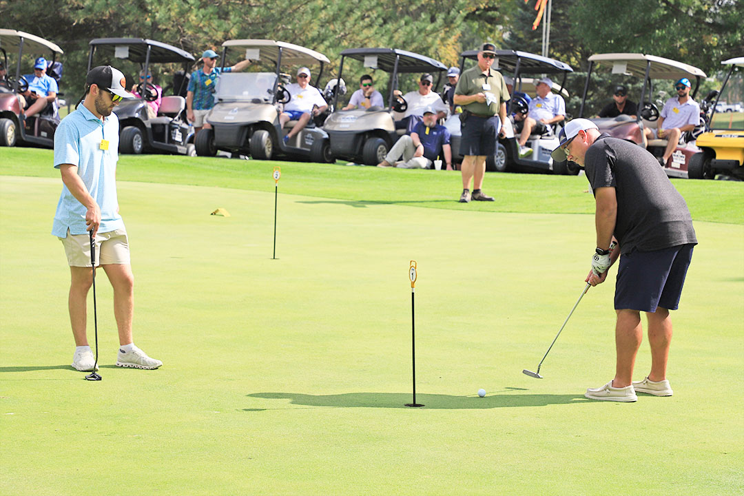 Colby Waller of Landmark Contracting, Inc., (left), and Chris Urquhart of Aggregate Equipment were the third place team in the Putting Tournament at their first GOMACO Invitational.