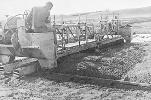 First airport paving completed in Mapleton, Iowa, with auger spreading attachment on a F-500