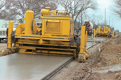 Two HW-165 pavers, two-lift paving with wire mesh
