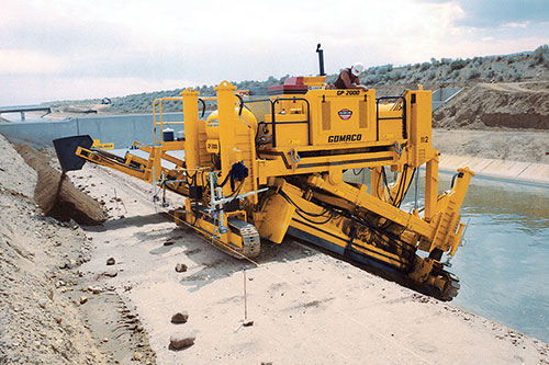 GP-2000 two-track slipform paver modified for slope trimming