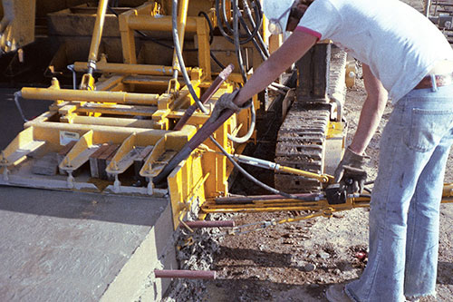 Tie bar inserter on HW-165B slipform paver