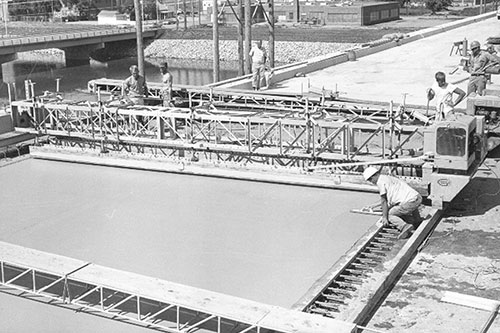 GOMACO's first three original products were the RC-120 side-discharge conveyor, the F-500 double-oscillating screed finisher, and the Spanit Work Bridge