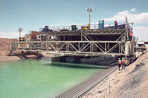 Underwater slipform canal paver for the Coachella Canal