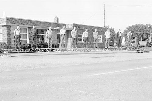 The 10 members of GOMACO’s Welding and Fabrication Departments demonstrate the strength of a 48 foot (14.6 m) long 1000 Series Spanit Work Bridge