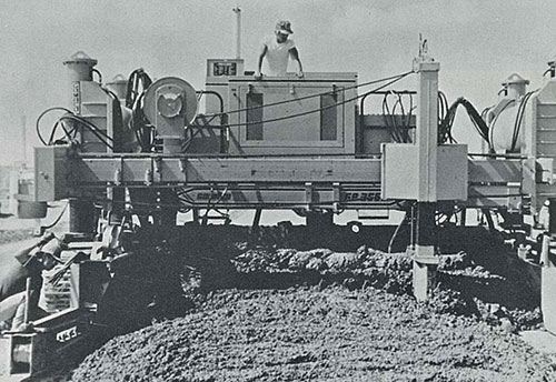 Spreader-plow feature for GOMACO slipform pavers