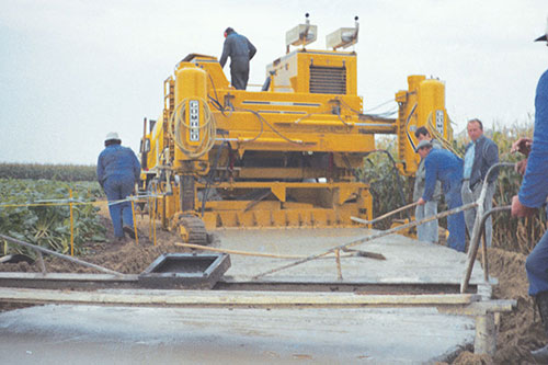 Commander IV barrier machine modified to trim and slipform 12 feet (3.7 m) wide