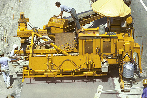 Early prototype of 12 foot (3.7 m) paving package on a Commander III