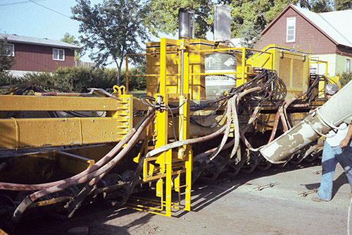 Prototype frame-mounted tie bar inserter on GP-2500 two-track slipform paver